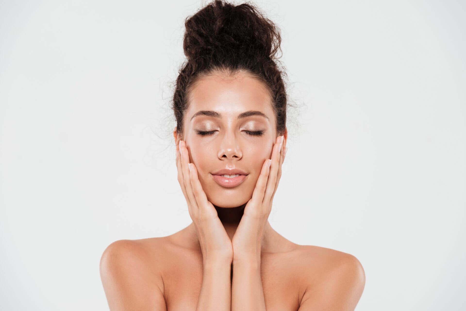 Beautiful woman touching her clean skin texture